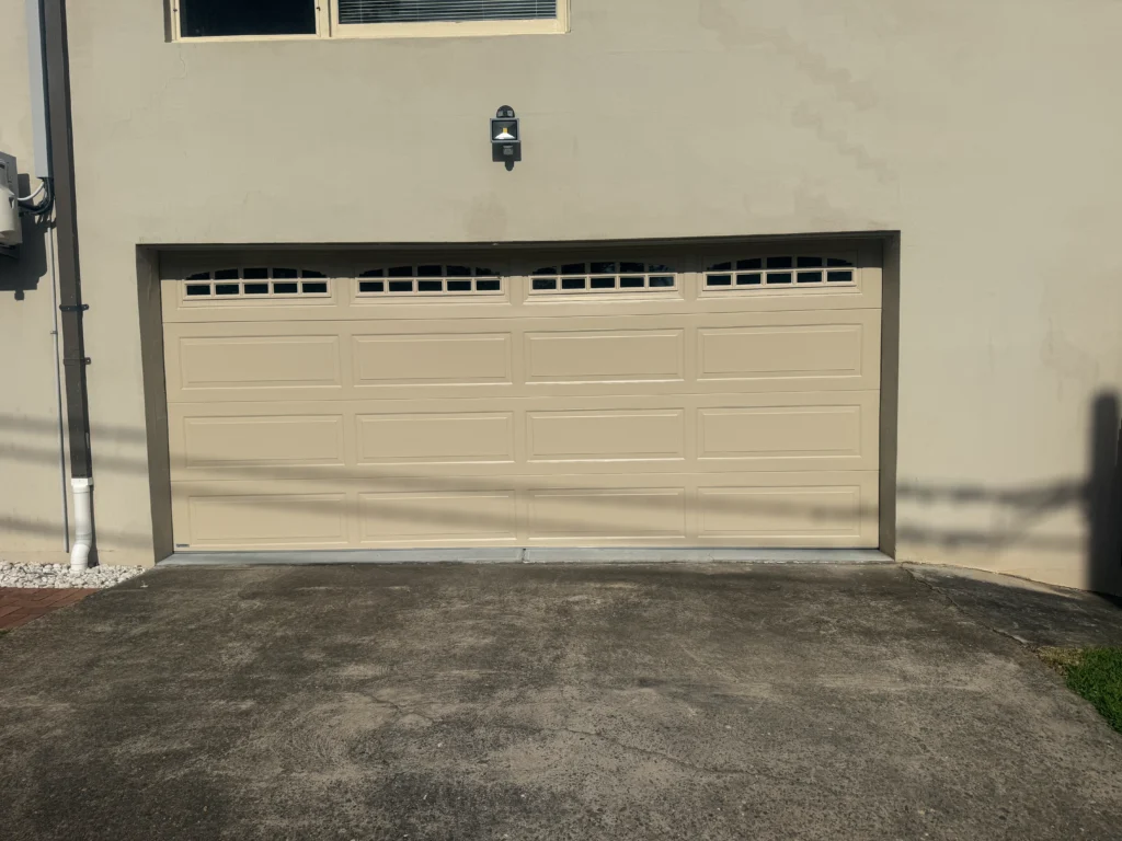 paperbark hampton smooth sectional door with cascade double windows