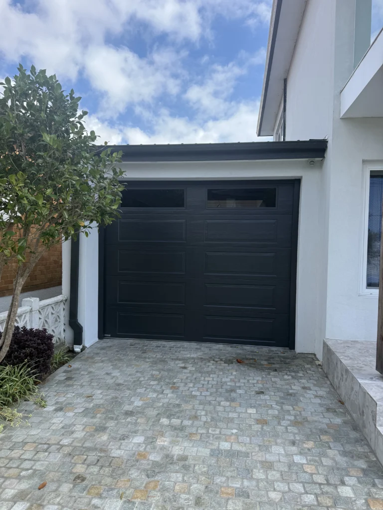 Monument Hamption Woodgrain Panel lift with traditonal windows